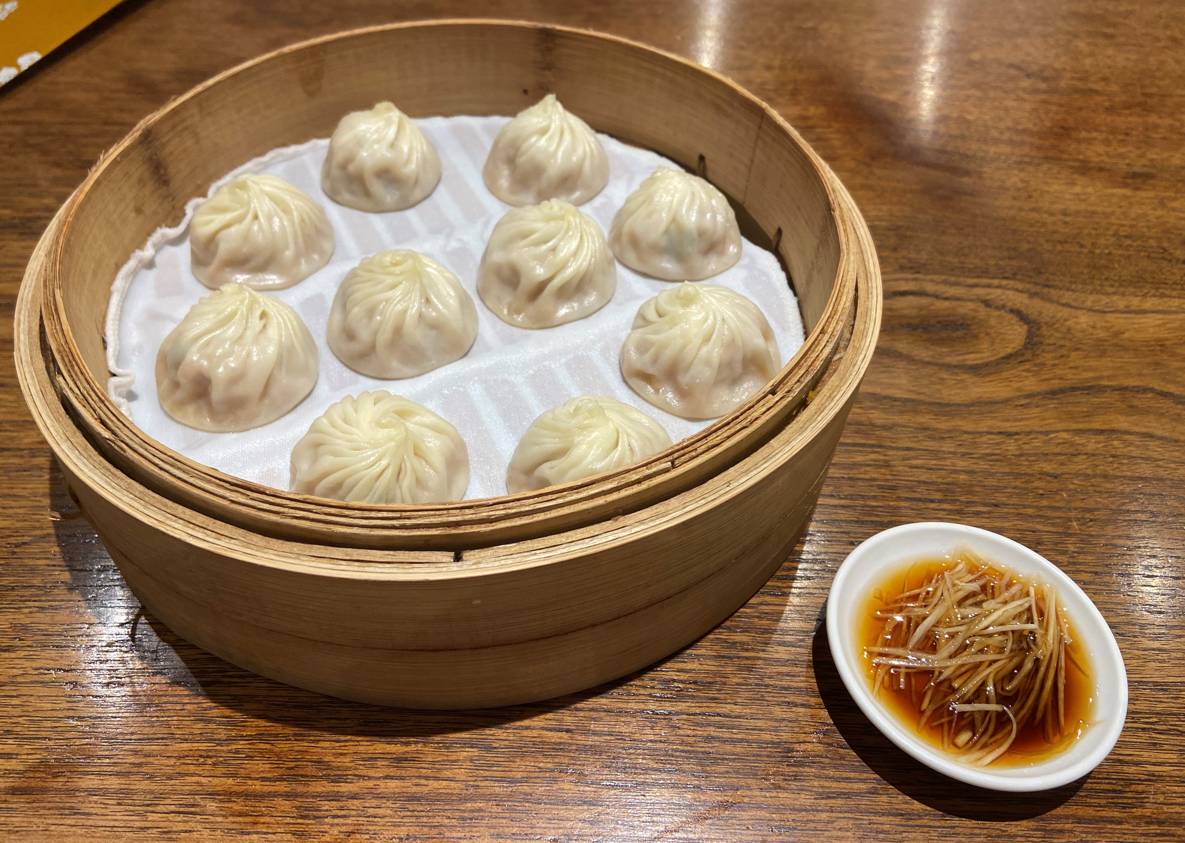 soup dumplings in bamboo steamer